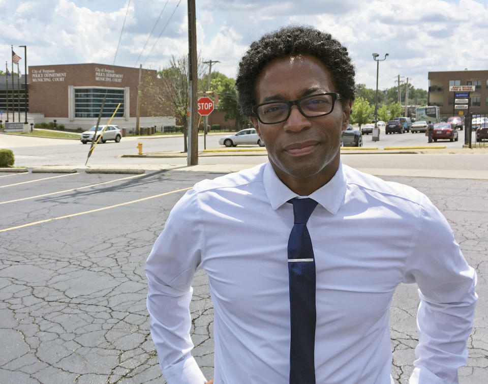 FILE - In this Aug. 8, 2018 photo, Wesley Bell stands outside the Ferguson, Mo., police headquarters a day after he defeated longtime St. Louis County prosecutor Bob McCulloch in the Democratic primary. Bell's 57 percent to 43 percent victory over McCulloch, a white prosecutor first elected in 1990, is the latest win for the Black Lives Matter movement, which has increasingly shifted from protest to local politics in recent years. Voters concerned with the killing of unarmed black people by police have made their voices heard from Ferguson to Cleveland to Chicago. (AP Photo/Jim Salter, File)