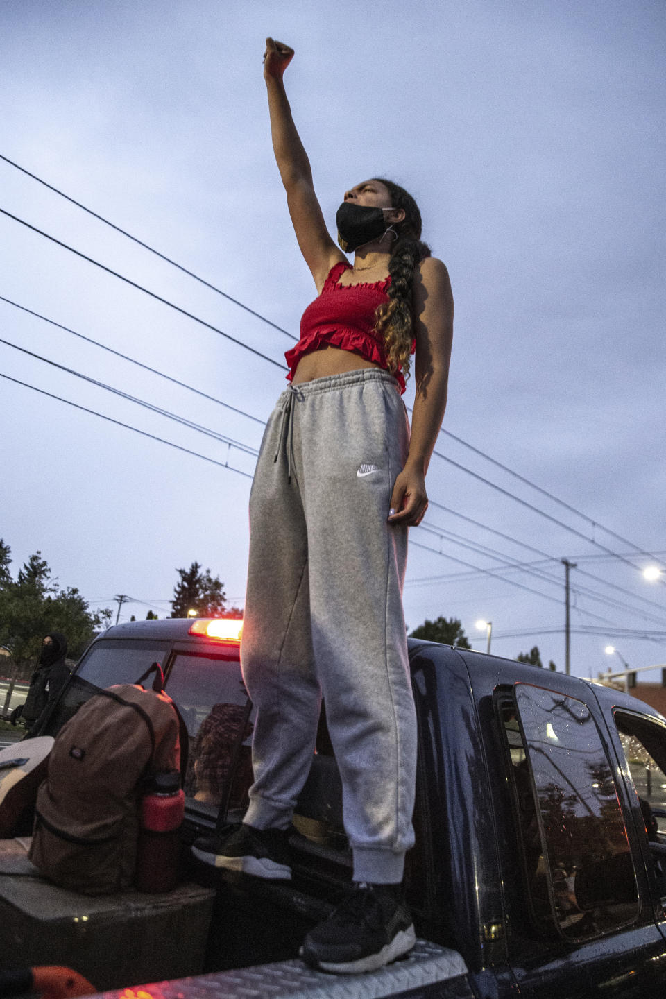 Protesters march from Kenton Park to the Portland Police Association in Portland, Ore., Thursday, Aug. 20, 2020. The event was peaceful and law enforcement did not intervene. (Mark Graves/The Oregonian via AP)