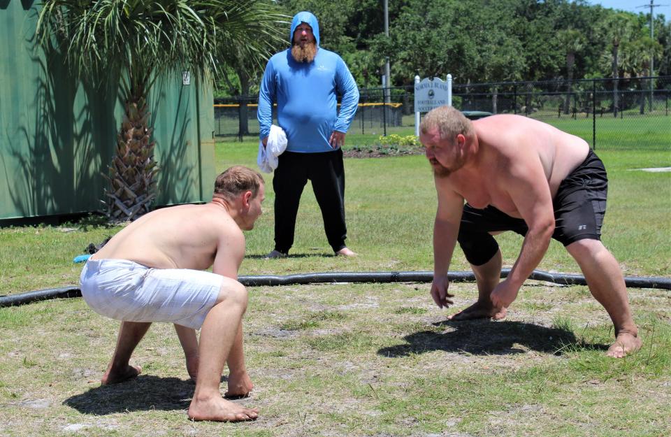 Mark Jones, (right) who will compete in October in a sumo tournament in Japan, trains at Derbyshire Park in Daytona Beach