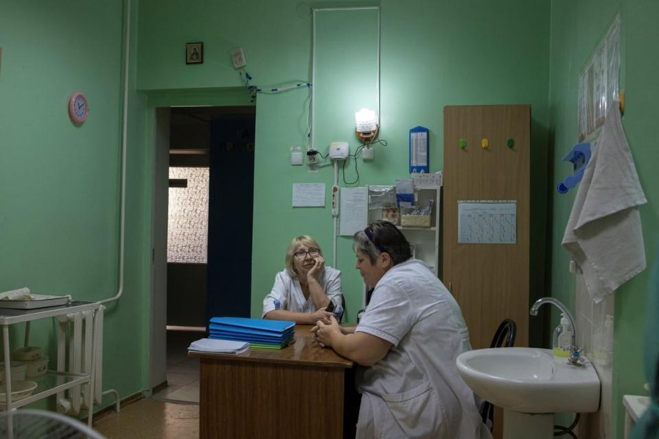 Nurses sit inside Pokrovsk maternity hospital (Reuters)