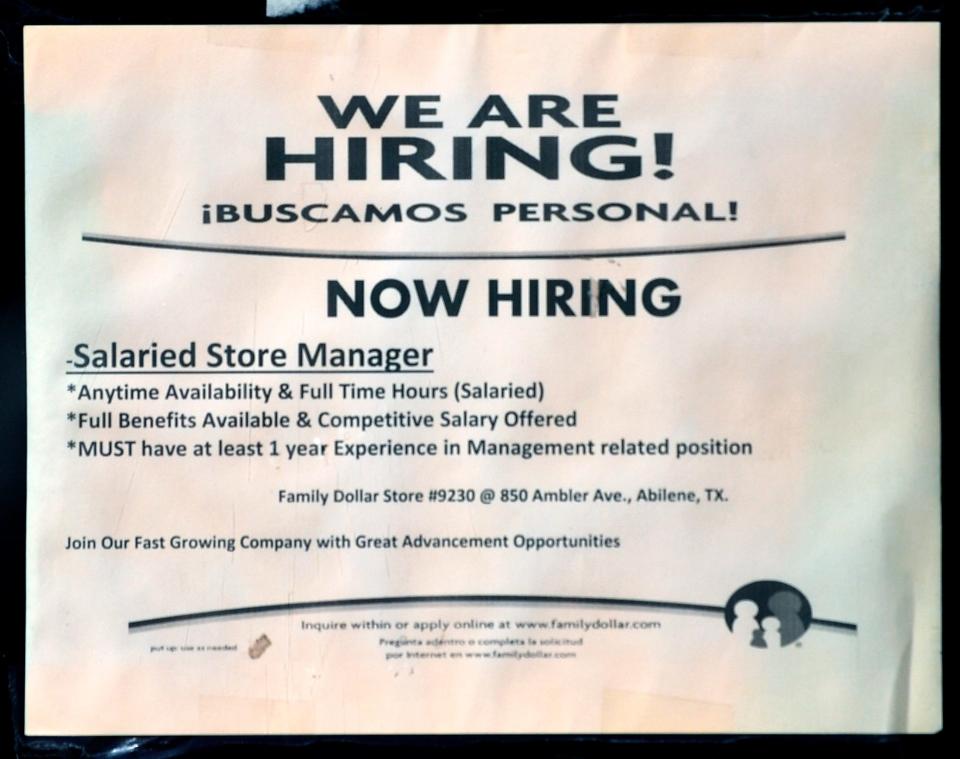A sign advertising for a store manager in Abilene Dec. 2, 2022.