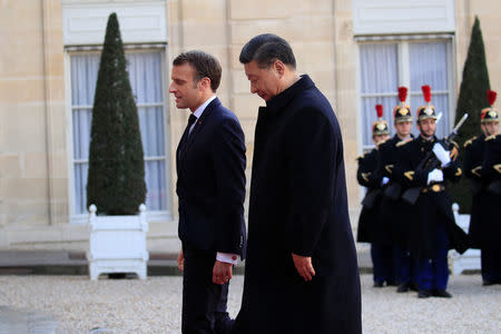 French President Emmanuel Macron welcomes Chinese President Xi Jinping at the Elysee Palace in Paris, France, March 25, 2019. REUTERS/Gonzalo Fuentes