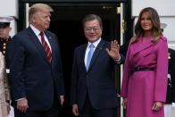 <p>This rich, plum coatdress was Melania's look of choice as she met with Korean President Moon Jae-in. The Louis Vuitton wool coat was an excellent pick for an early Spring day in 2019.</p>