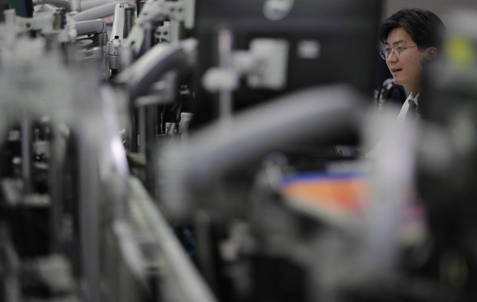 A currency trader watches computer monitors at the foreign exchange dealing room in Seoul, South Korea, Thursday, June 13, 2019. Asian stocks were mixed on Thursday as protesters in Hong Kong vowed to keep opposing a proposed extradition bill they fear would whittle down the territory’s legal autonomy. (AP Photo/Lee Jin-man)