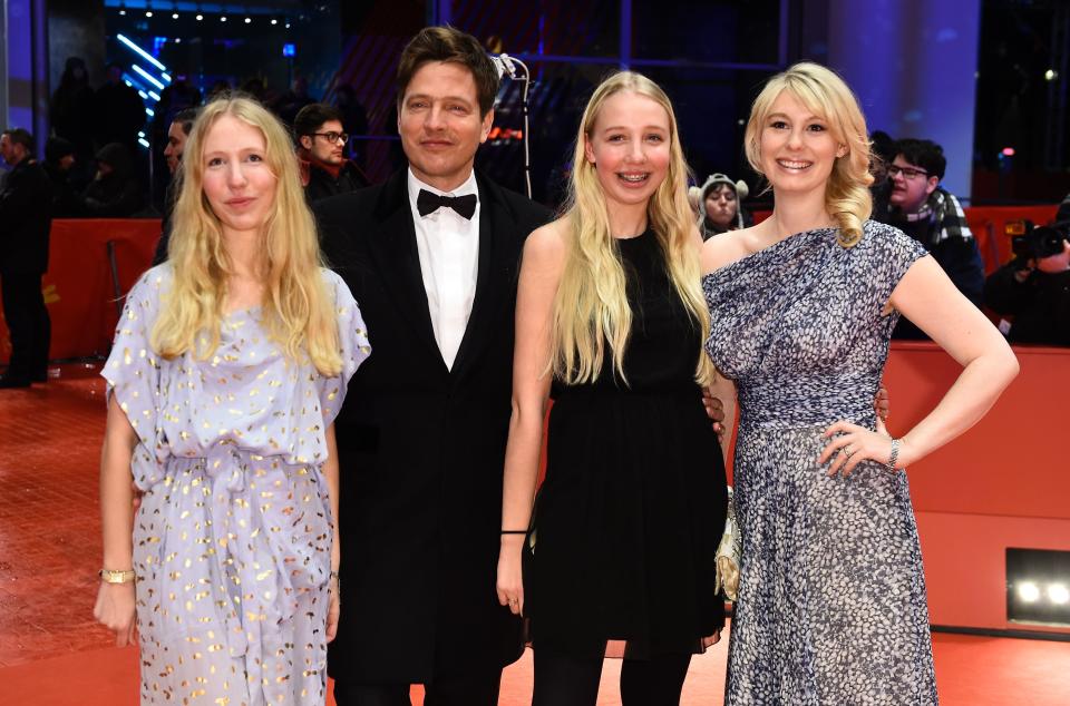 Danish director Thomas Vinterberg with daughters Nana (L) and Ida (2ndR) and actress Helene Reingaard Neumann (R) poses on the red carpet ahead of the screeing of the film 