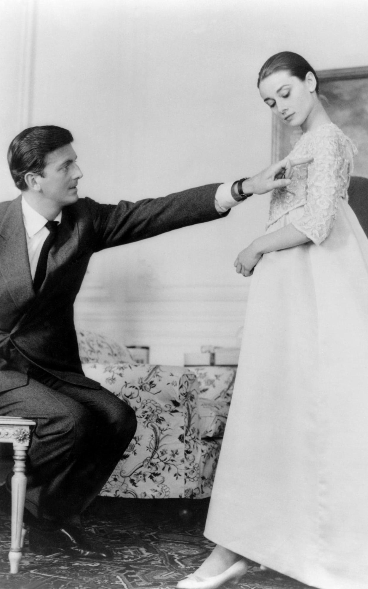 Hubert de Givenchy with Audrey Hepburn at his atelier in Paris - Corbis Historical