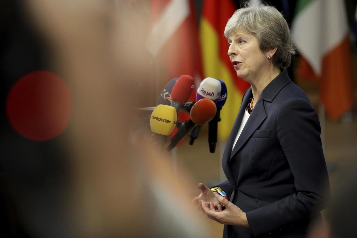 Theresa May speaks to the media as she arrives in Brussels for the summit: AP