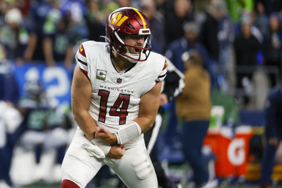 Washington Commanders quarterback Sam Howell (14) celebrates. Mandatory Credit: Joe Nicholson-USA TODAY Sports