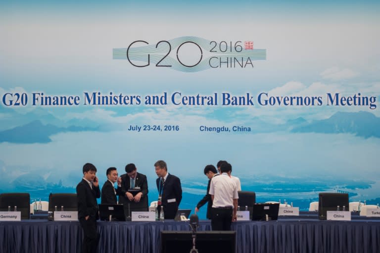 Event officials set up a meeting room on the eve of the G20 Finance Ministers and Central Bank Governors Meeting in Chengdu, China's south-western Sichuan province, on July 22, 2016