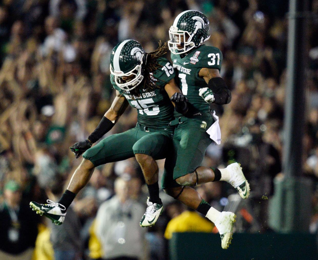 Darqueze Dennard, right, and Trae Waynes, here celebrating MSU's Rose Bowl win on Jan. 1, 2014, gave the Spartans two lockdown corners on perhaps the best defense in school history.