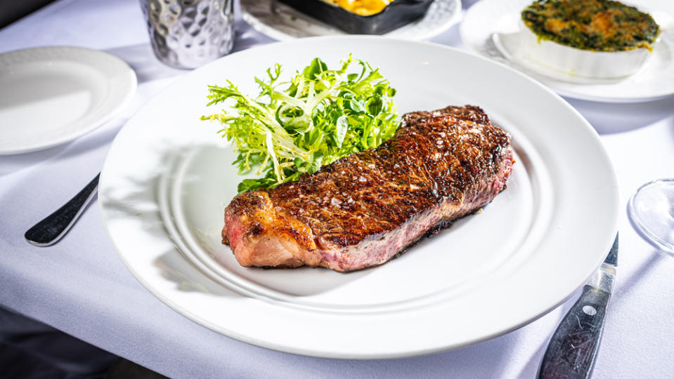 new york strip steak white tablecloth