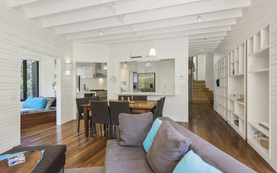 <p>The open-plan home has renewable timber floors, white weatherboard walls and lots of large windows offering lots of natural light.</p>