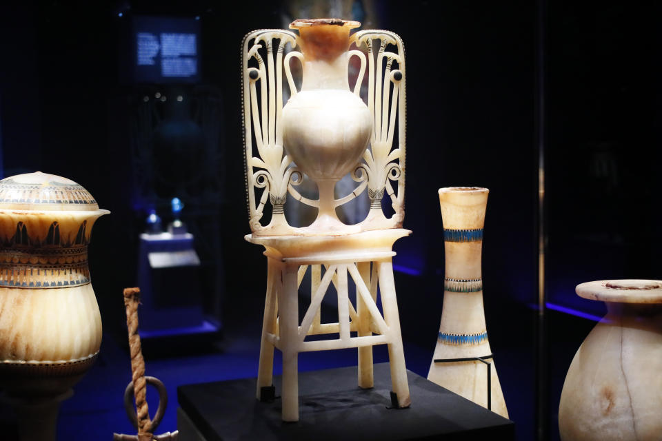 A calcite unguent vase with papyrus and lotus flower design is displayed as part of 'Tutankhamun, the treasure of the Pharaoh', an exhibition in partnership with the Grand Egyptian Museum at the Grande Halle of La Villette in Paris, France, Thursday, March 21, 2019. This exhibition, which runs from 23 March to 15 September 2019. will reveal 150 fascinating original objects found in 1922 in the tomb of the most famous Pharaoh. (AP Photo/Francois Mori)