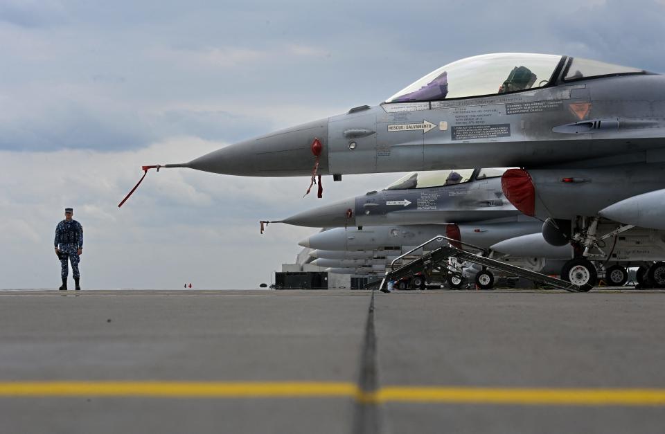 Portugese Air Force and Romanian Air Force F-16 jetfighters sit on the tarmac of Siauliai airbase in Lithuania during the NATO exercise as part of the NATO Air Policing mission, on July 4, 2023.