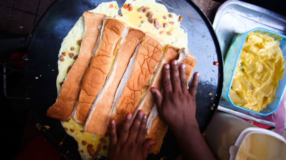 A Muslim trader prepares a Roti John during a Ramadan bazaar in Kuala Lumpur. - Rahman Roslan/Getty Images AsiaPac/Getty Images