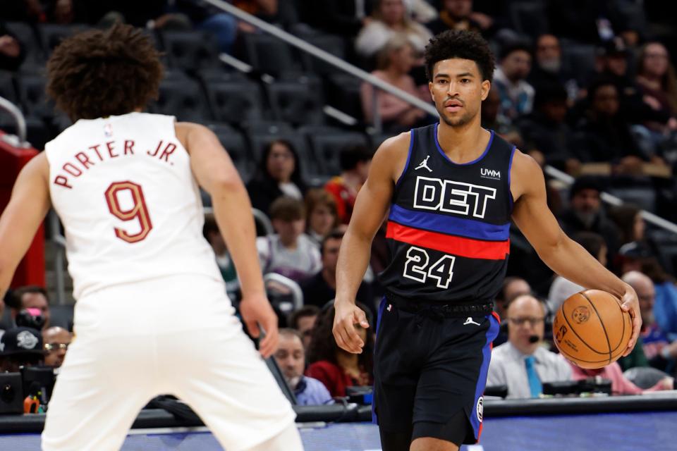 Pistons guard Quentin Grimes dribbles defended by Cavaliers guard Craig Porter in the first half on Friday, March 1, 2024, at Little Caesars Arena.