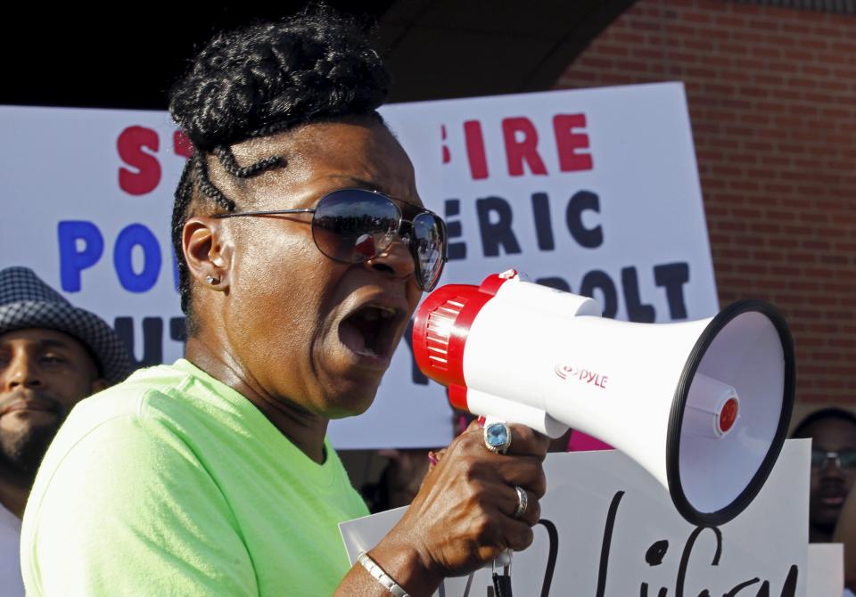 A woman speaks during a protest against what demonstrators call police brutality in McKinney, Texas June 8, 2015. Hundreds marched through the Dallas-area city of McKinney on Monday calling for the firing of police officer Eric Casebolt, seen in a video throwing a bikini-clad teenage girl to the ground and pointing his pistol at other youths at a pool party disturbance. REUTERS/Mike Stone