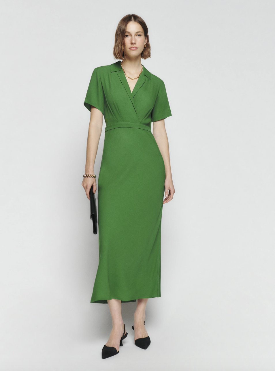 model in emerald green short sleeve midi dress from reformation, Danika Dress (photo via Reformation)