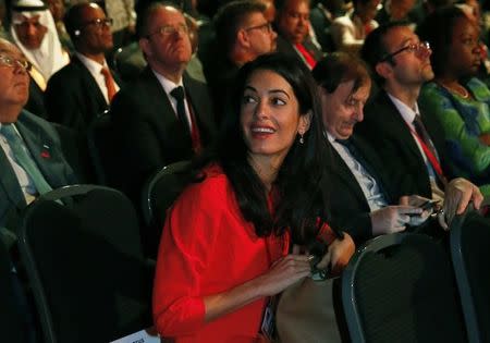 Barrister Amal Alamuddin, fiancee of actor George Clooney, attends a summit to end sexual violence in conflict at the Excel centre in London June 12, 2014. REUTERS/Luke MacGregor/Files