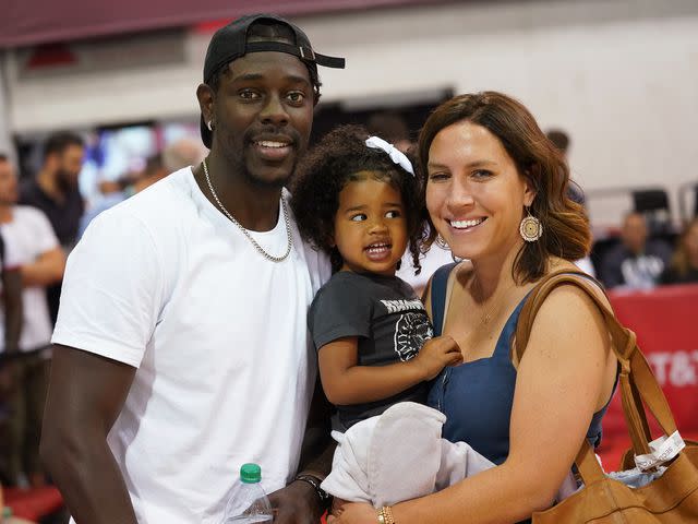 <p>Cassy Athena/Getty</p> Jrue Holiday, daughter J.T. and wife Lauren Holiday during the 2019 NBA Summer League