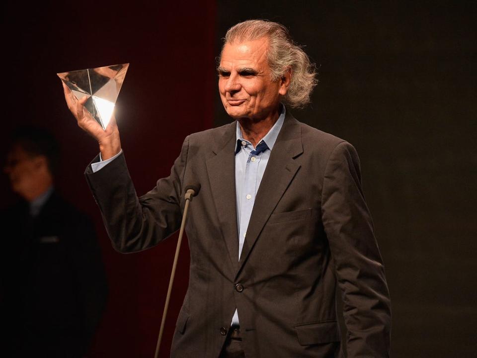 Demarchelier receiving the Photographer of the Year award in 2013 (Getty)