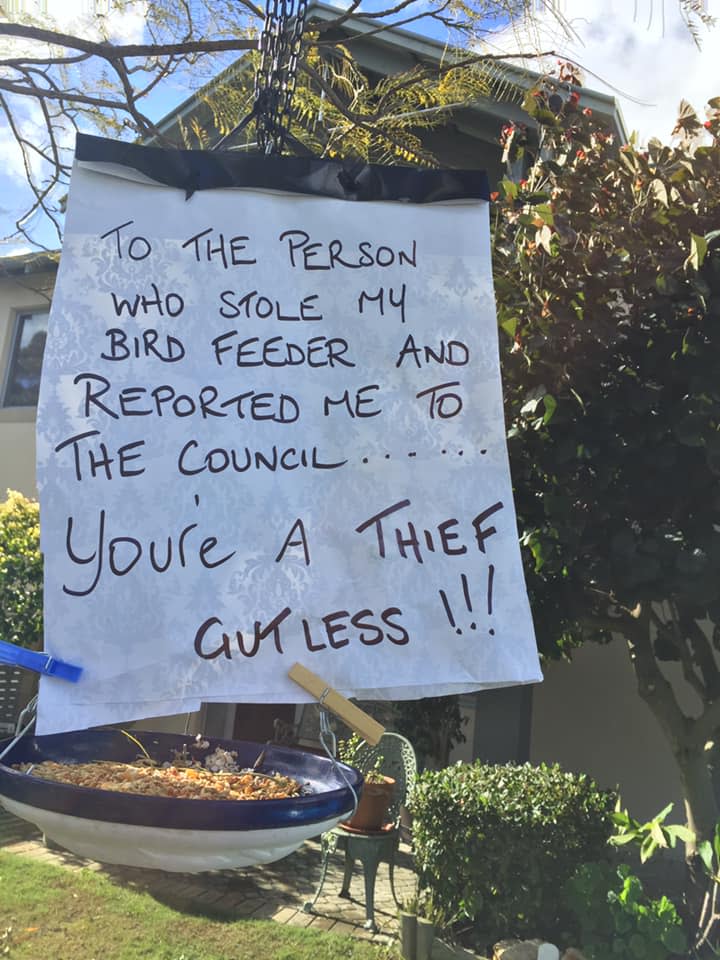 Photo of a sign to a person who stole a bird feeder from the front of a Mandurah home in Western Australia. 