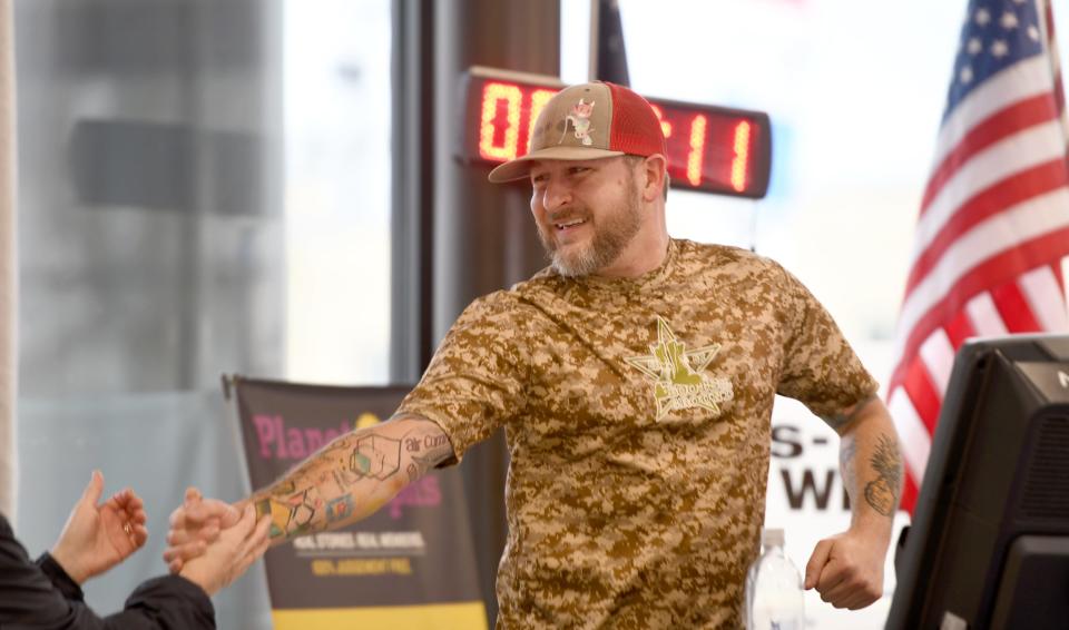 Stephen Strawn joined his friend, Marine veteran Bob Mohr, on a 24-hour treadmill "run-a-thon" to benefit Wishes Can Happen. Mohr was raising money for a family who lost their 11-year-old son to cancer last year. The treadmills, set up at Kempthorn Motors in Canton, were donated by Planet Fitness.
