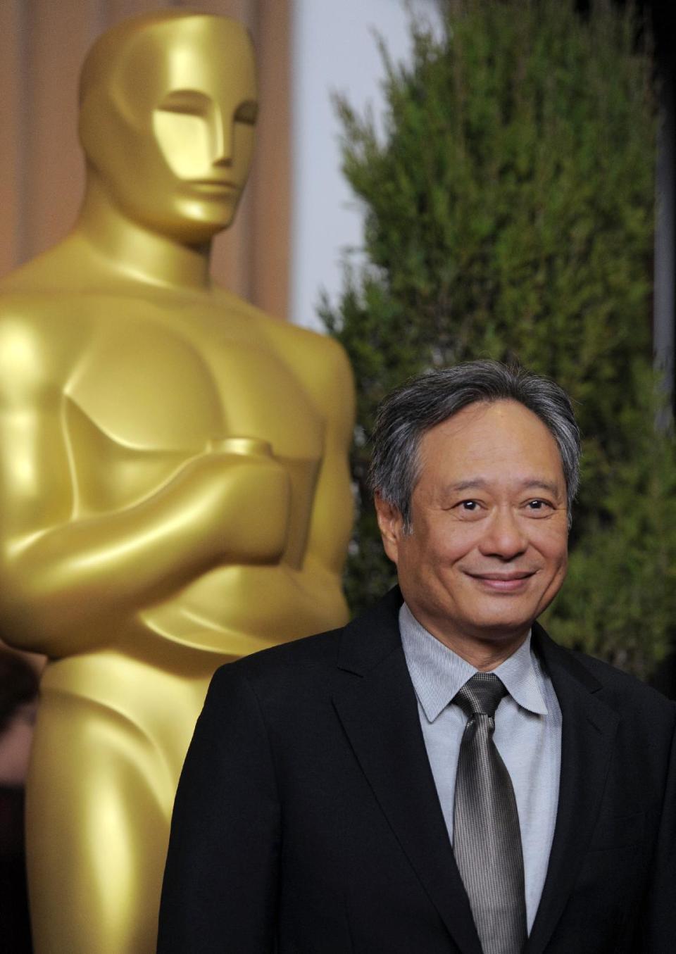 FILE - In this Monday, Feb. 4, 2013 file photo, Ang Lee, nominated for best picture and directing for "Life of Pi," arrives at the 85th Academy Awards Nominees Luncheon at the Beverly Hilton Hotel, in Beverly Hills, Calif. With 11 Academy Awards nominations, second only to “Lincoln” with 12, and the sort of global box-office receipts normally reserved for superheroes, “Life of Pi” is one of the most unusual megahits ever to hit the big-screen. (Photo by Chris Pizzello/Invision/AP, File)