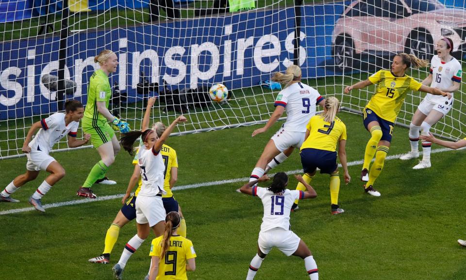 USWNT players celebrate.