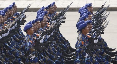 Marine patrol servicemen hold Israeli-made Galil riffles while marching during a celebration to mark National Day at Ba Dinh square in Hanoi September 2, 2015. Photo taken September 2, 2015. REUTERS/Kham -