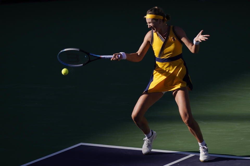 Victoria Azarenka, of Belarus, returns a shot to Jessica Pegula at the BNP Paribas Open tennis tournament Wednesday, Oct. 13, 2021, in Indian Wells, Calif. (AP Photo/Mark J. Terrill)