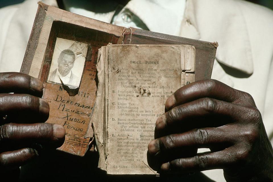 Dekemani Mzuzwa with his pass book that he is waiting to exchange for a new passport in 1994. David Turnley/Corbis/VCG via Getty Images