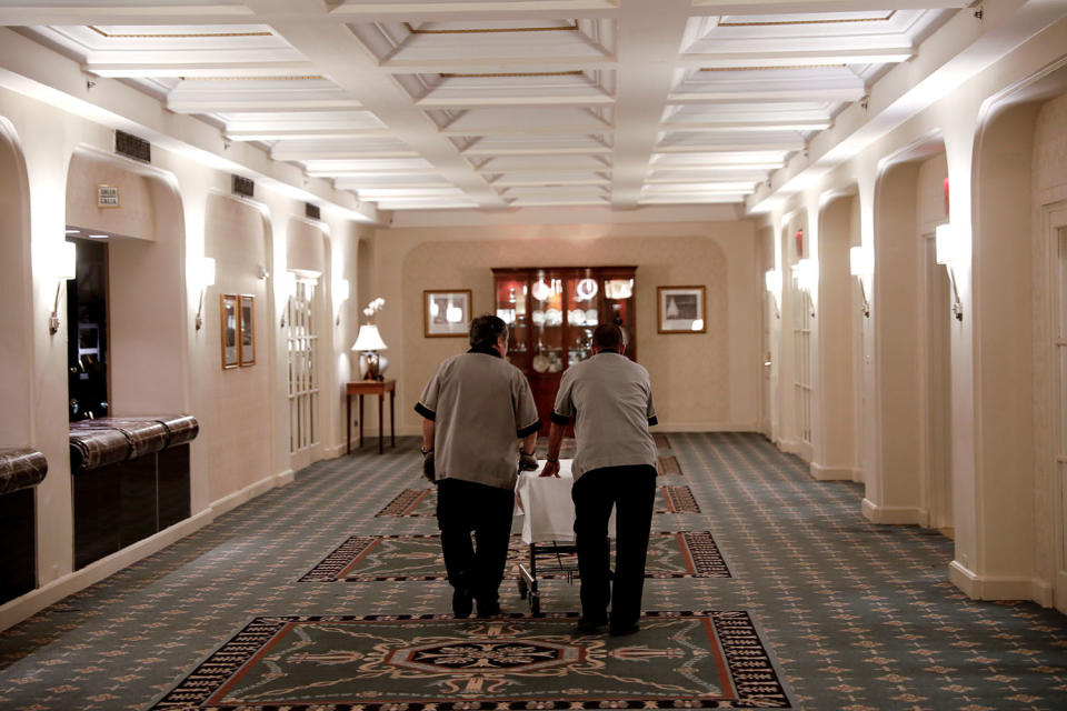 <p>Employees walk through a hallway on the ballroom level inside the Waldorf Astoria hotel in New York, Feb. 28, 2017. (Photo: Mike Segar/Reuters) </p>