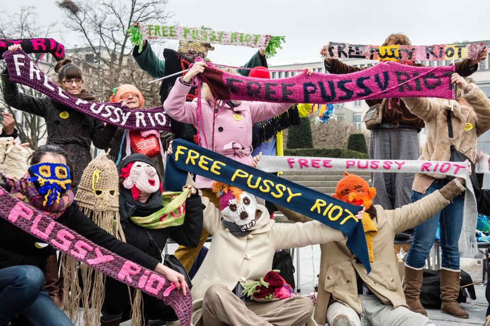Amnesty International members hold their hand knitted Pussy Riot fan scarfs to support the members of the Russian punk band, in Brussels on Sunday Feb. 17, 2013. (AP Photo/Geert Vanden Wijngaert)
