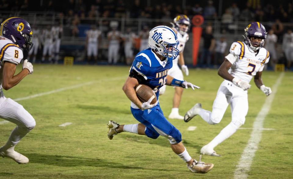 Ripon Christian’s Grant Sonke evades Orestimba defenders on a run during the Southern League game in Ripon, Calif., Friday, Sept. 22, 2023.