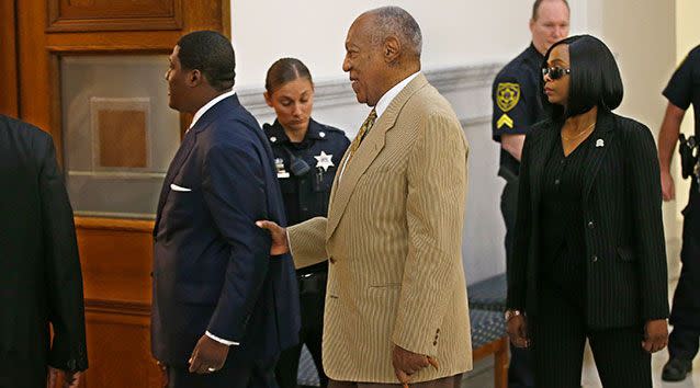 Bill Cosby is helped into Courtroom A in the Montgomery County Courthouse by an aide. Source: Getty.