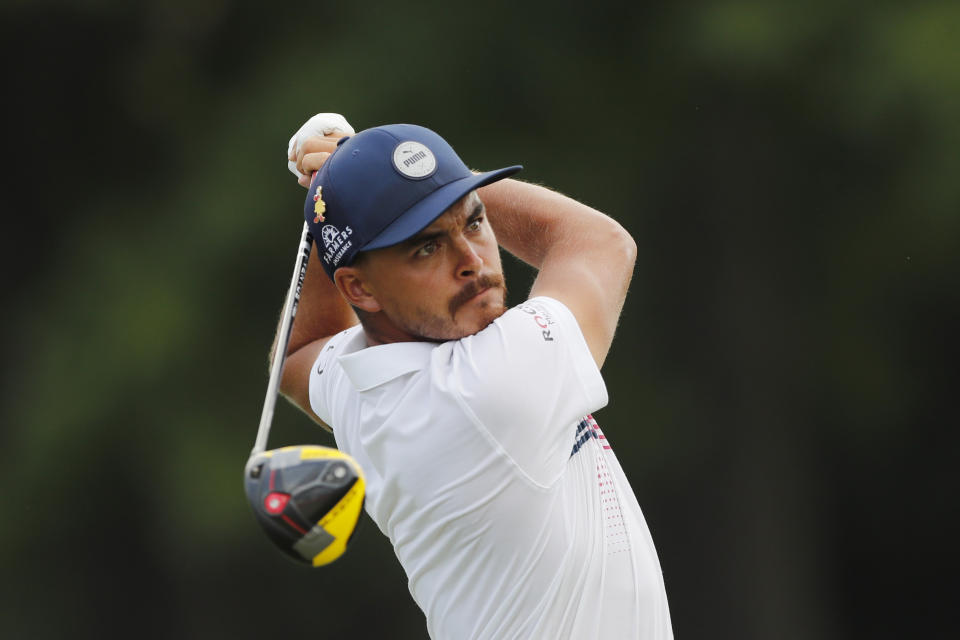 Rickie Fowler drives off the 17th tee during the second round of the Rocket Mortgage Classic golf tournament, Friday, July 3, 2020, at the Detroit Golf Club in Detroit. (AP Photo/Carlos Osorio)