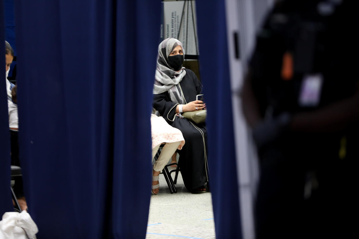 Afghan refugees evacuated from Kabul, arrive in Washington Dulles International Airport in Washington, DC, United States on August 27, 2021. (Yasin Ozturk/Anadolu Agency via Getty Images)