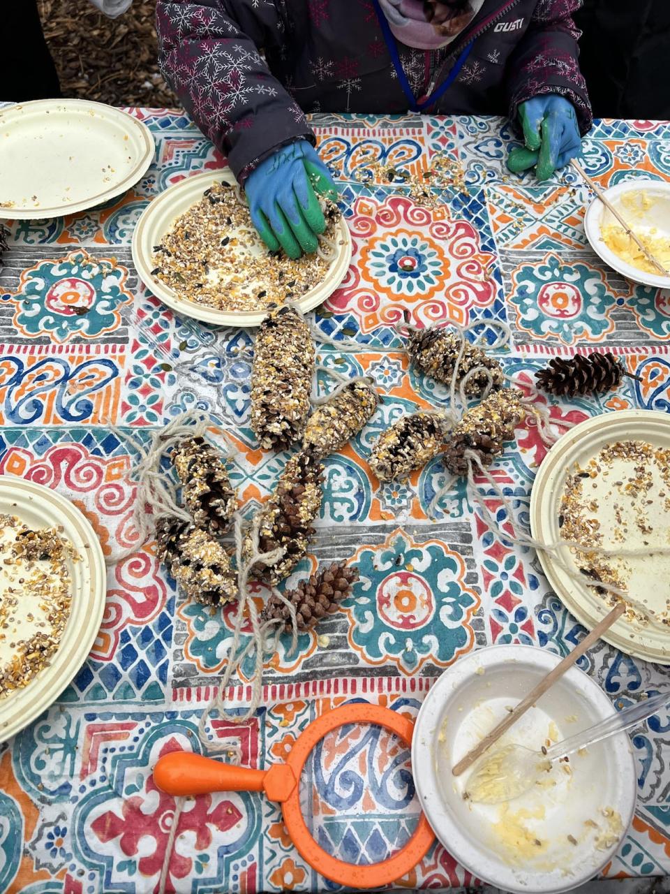 Children make bird feeders at Thorncliffe Park's urban farm.