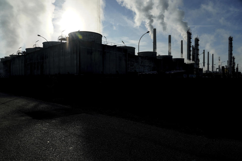 FILE - In this Oct. 15, 2021 file photo, smoke rises from the Feyzin Total refinery chimneys, outside Lyon, central France. The World Meteorological Organization says greenhouse gas concentrations hit a new record high last year and continued to increase at a faster clip than the average rate in the last decade, despite a temporary blip downward amid coronavirus-linked lockdowns. The U.N. weather agency, releasing its flagship annual report on heat-trapping gases in the atmosphere on Monday Oct. 25, 2021, said concentrations of carbon dioxide, methane and nitrous oxide are all above levels in the pre-industrial era pegged to before 1750, when human activities “started disrupting Earth’s natural equilibrium.”(AP Photo/Laurent Cipriani, file)