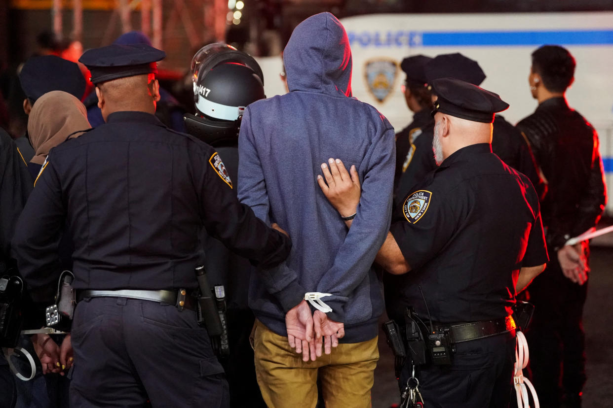 Police detain a protester at Columbia.