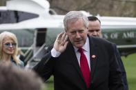 Acting White House Chief of Staff Mark Meadows holds his hand to his ear to hear a question after stepping off Marine One as they return to the White House, Saturday, March 28, 2020, in Washington. President Donald Trump is returning from Norfolk, Va., for the sailing of the USNS Comfort, which is headed to New York. (AP Photo/Alex Brandon)
