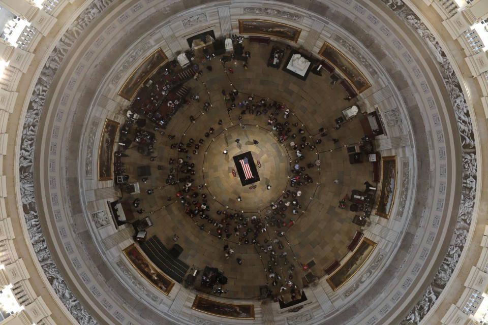 Former President George H. W. Bush lies in state in the U.S. Capitol Rotunda Tuesday, Dec. 4, 2018, in Washington. (Pool photo by Morry Gash via AP)