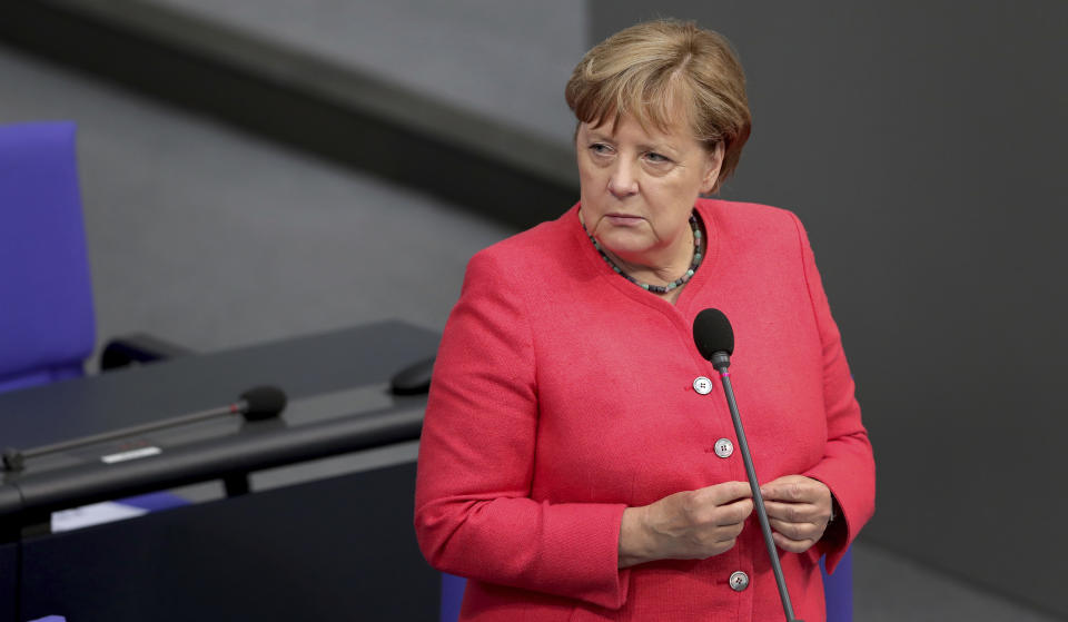 German Chancellor Angela Merkel takes questions of a lawmaker of the far right party 'Alternative fuer Deutschland' (Alternative for Germany) during a meeting of the German federal parliament, Bundestag, at the Reichstag building in Berlin, Germany, Wednesday, July 1, 2020. (AP Photo/Michael Sohn)