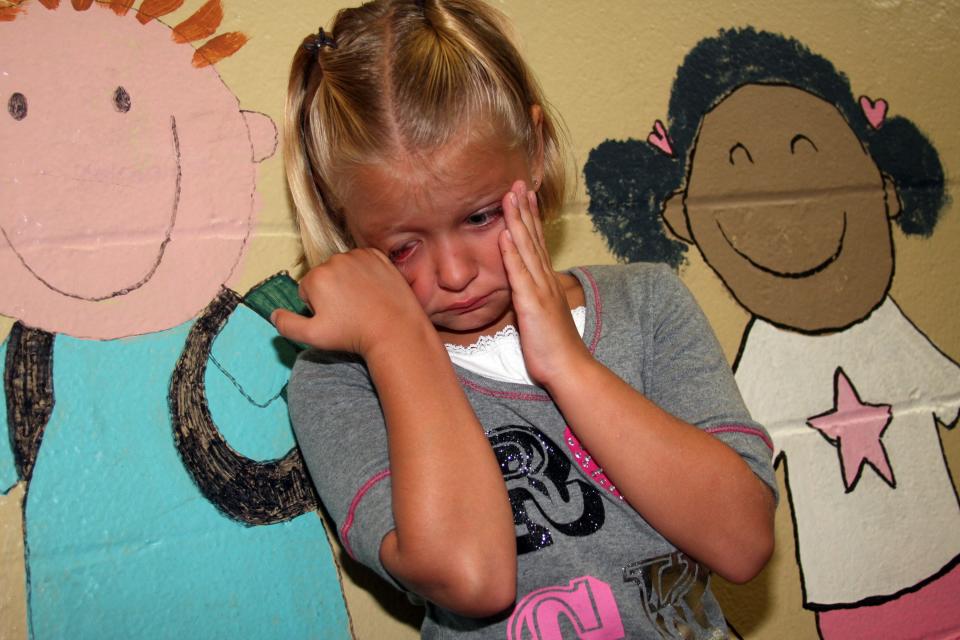 San Pablo Elementary first-grader Victoria Baumgartner sheds tears on the first day of the 2009-2010 school year. Despite her mother's hugs and kisses, she wasn't ready to end her summer vacation and go back to school. "She's not having it," her mom, Sara Boles, said.