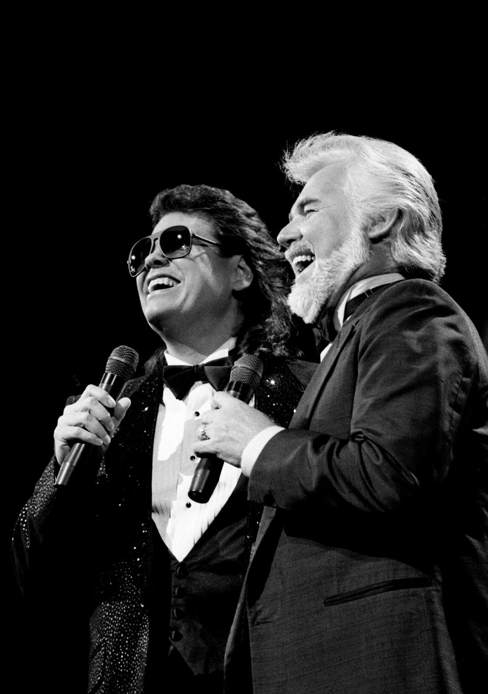 Host Kenny Rogers, right, and country-pop hero Ronnie Milsap are recreating their hit duet, "Make No Mistake She's Mine," during the 21st annual CMA Awards show at the Grand Ole Opry House Oct. 12, 1987.