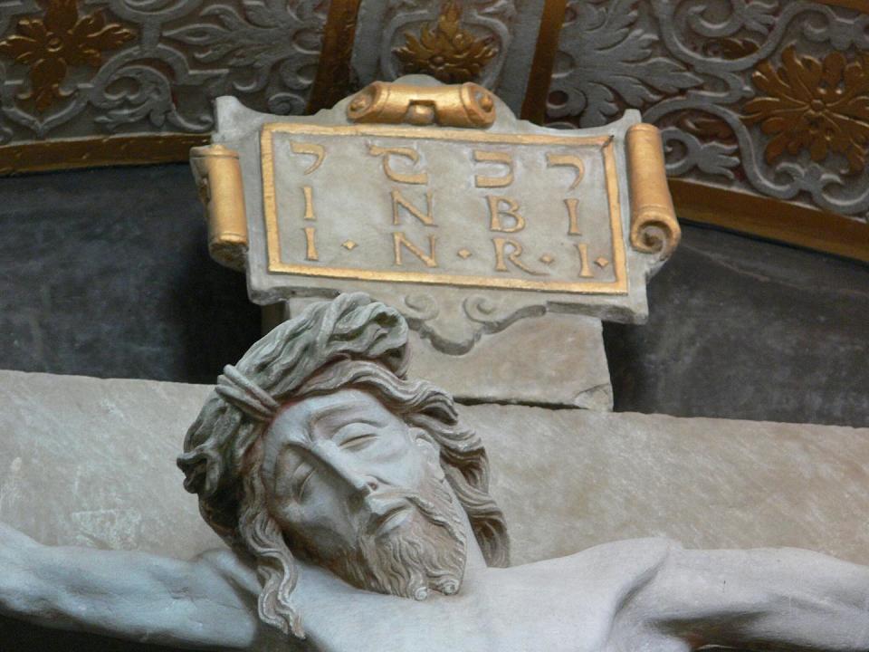 Crucifixes often display the Latin abbreviation ‘INRI,’ short for ‘Jesus of Nazareth, King of the Jews.’ This statue in Germany’s Ellwangen Abbey shows the abbreviation in three languages. <a href="https://commons.wikimedia.org/wiki/File:Ellwangen_St_Vitus_Vorhalle_Kreuzaltar_detail2.jpg" rel="nofollow noopener" target="_blank" data-ylk="slk:Andreas Praefcke/Wikimedia Commons;elm:context_link;itc:0;sec:content-canvas" class="link ">Andreas Praefcke/Wikimedia Commons</a>, <a href="http://creativecommons.org/licenses/by-sa/4.0/" rel="nofollow noopener" target="_blank" data-ylk="slk:CC BY-SA;elm:context_link;itc:0;sec:content-canvas" class="link ">CC BY-SA</a>