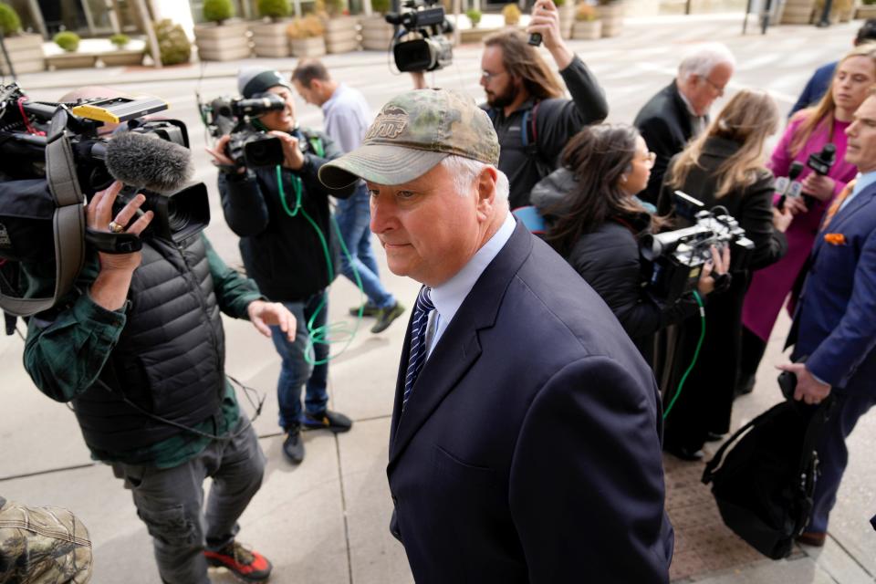 Former Ohio House Speaker Larry Householder is surrounded by the media outside the  Potter Stewart U.S. Courthouse in downtown Cincinnati March 9, 2023 after a jury found him and ex-Ohio Republican Party chairman Matt Borges guilty of racketeering conspiracy .