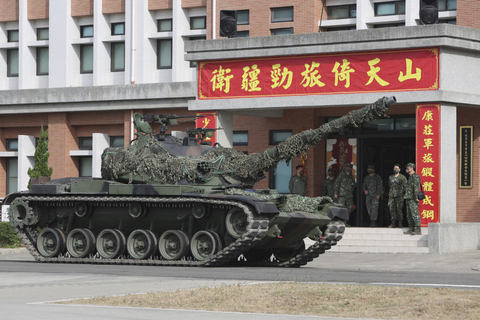 FILE - A tank is deployed during a preparedness enhancement drill simulating the defense against Beijing's military intrusions, ahead of the Lunar New Year in Kaohsiung City, Taiwan on Wednesday, Jan 11, 2023. An independent Sweden-based watchdog says the world military spending has grown for the eighth consecutive year in 2022 to an all-time high of $2240 billion leading to a sharp rise of 13% taking place in Europe, chiefly due to Russian and Ukrainian expenditure." (AP Photo/Daniel Ceng, File)