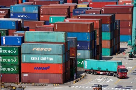 Shipping containers are seen at the port in Shanghai, China April 10, 2018. REUTERS/Aly Song